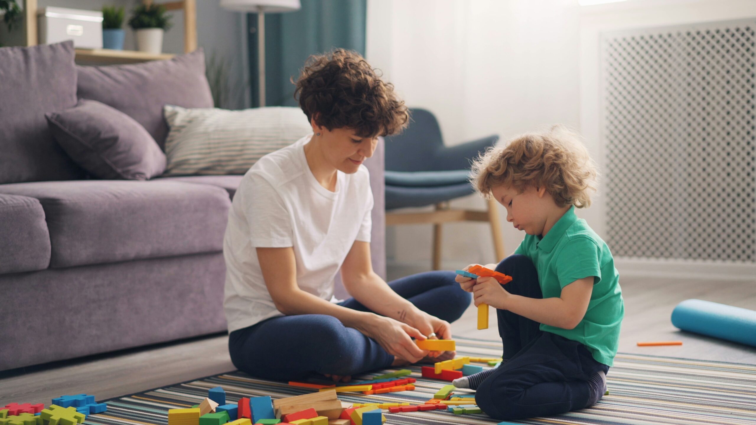 DIR 101 in Yerevan: Introductory DIRFloortime® Course Adult and child playing with blocks on the floor